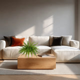 Grüne Kunstpflanze Proliferum in einem weißen Topf auf einem Holztisch von hjh OFFICE