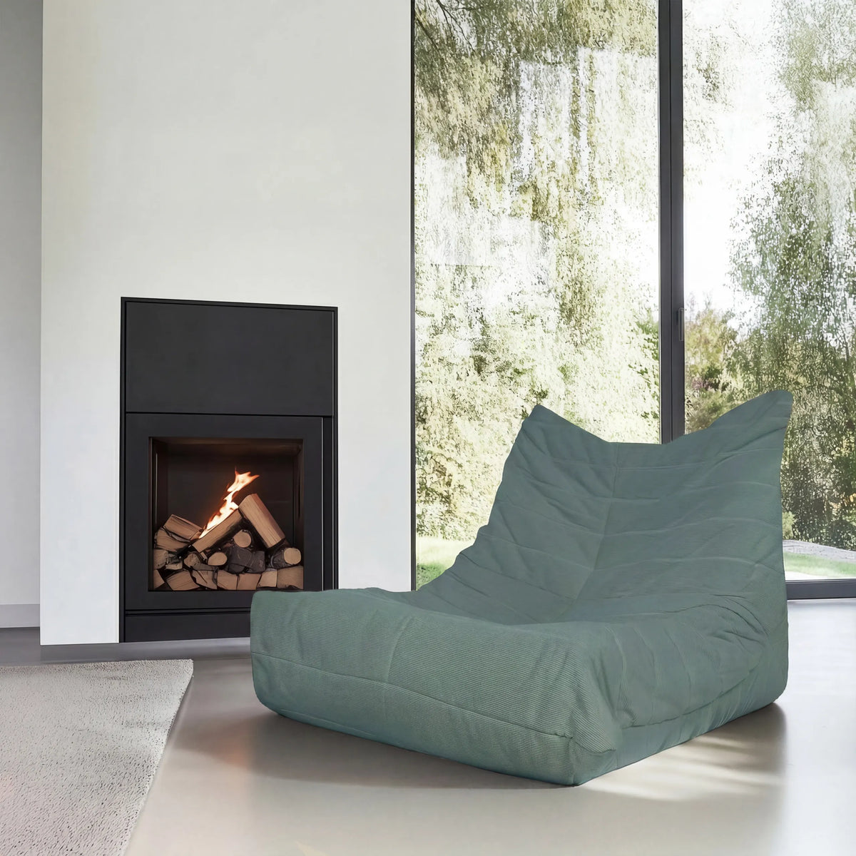 Loungesessel Sitzolo mit taubenblauem Stoffbezug in einer modernen Wohnumgebung von hjh LIVING